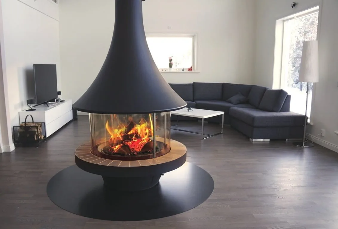 Central freestanding slow-combustion fireplace in an open-plan living space