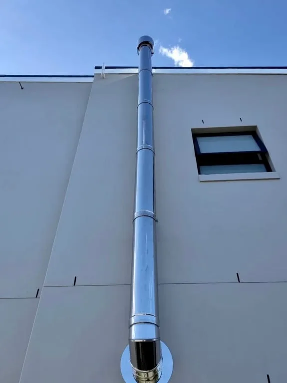 DINAK stainless steel double-wall flue through ceiling detail