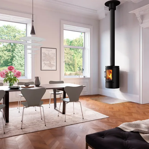 HWAM 2620C wall-mounted fireplace in a dining room