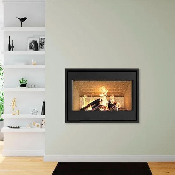 HWAM I40/55C insert fireplace beside a sofa