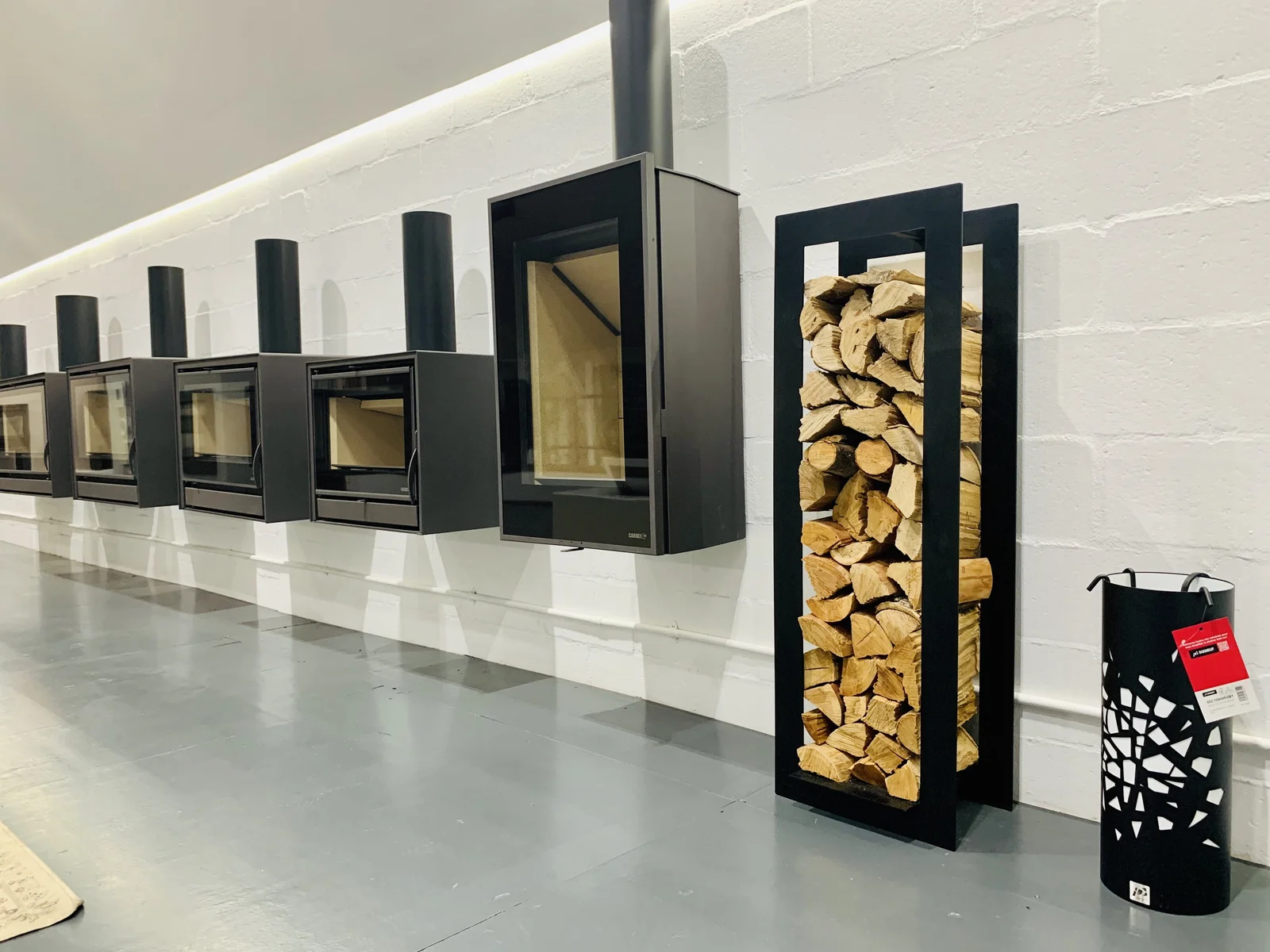 Fireplace log holder accessory displayed with firewood